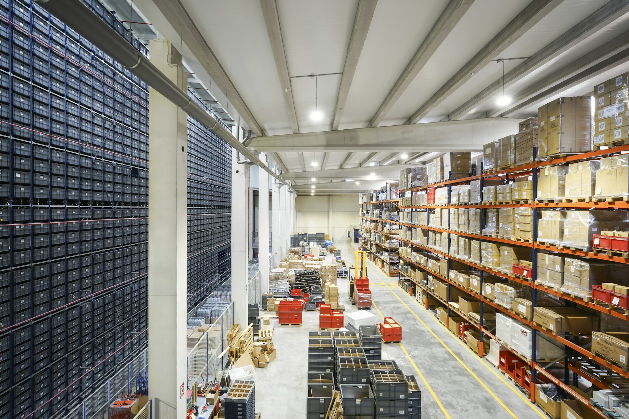 Distribution warehouse aisle stacked with palletized cargo